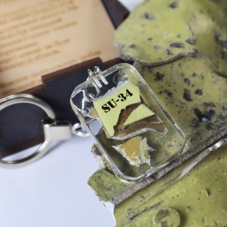 A key ring with a taken down russian SU-34 wreckage