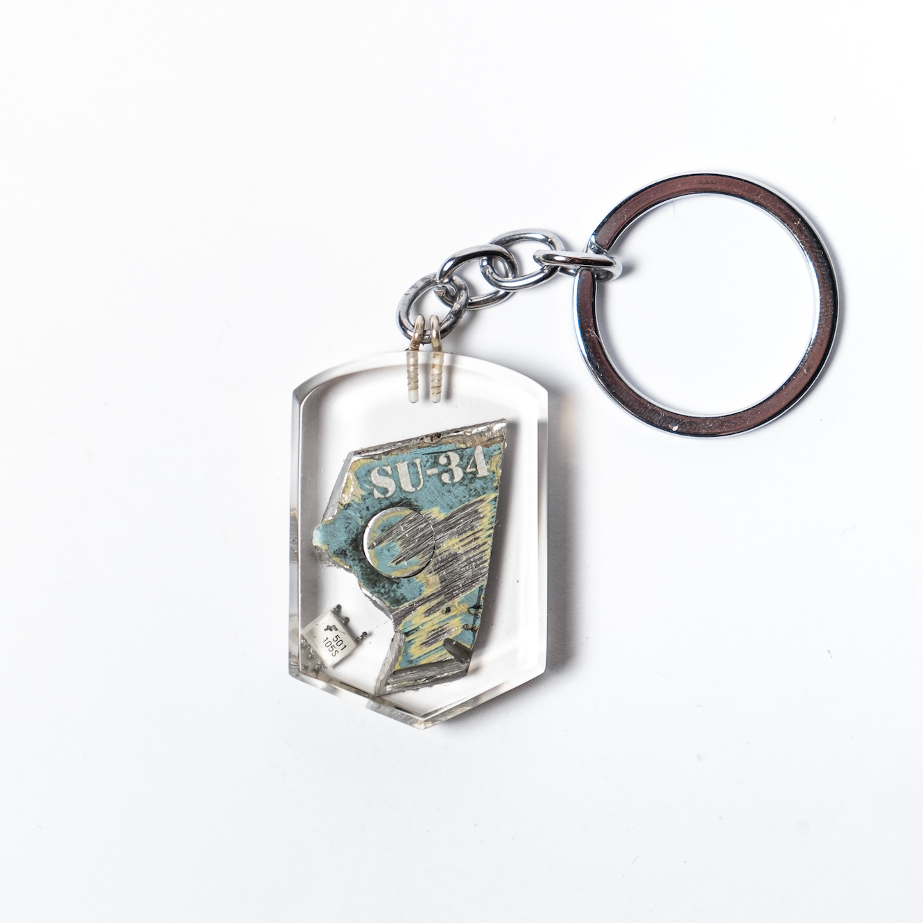 A key ring with a taken down russian SU-34 wreckage