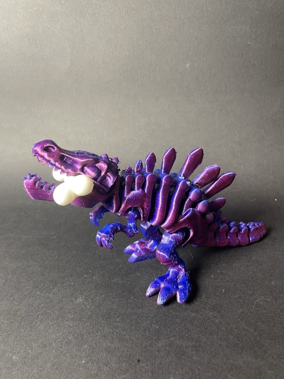 Динозавр  рухомий з кісткою