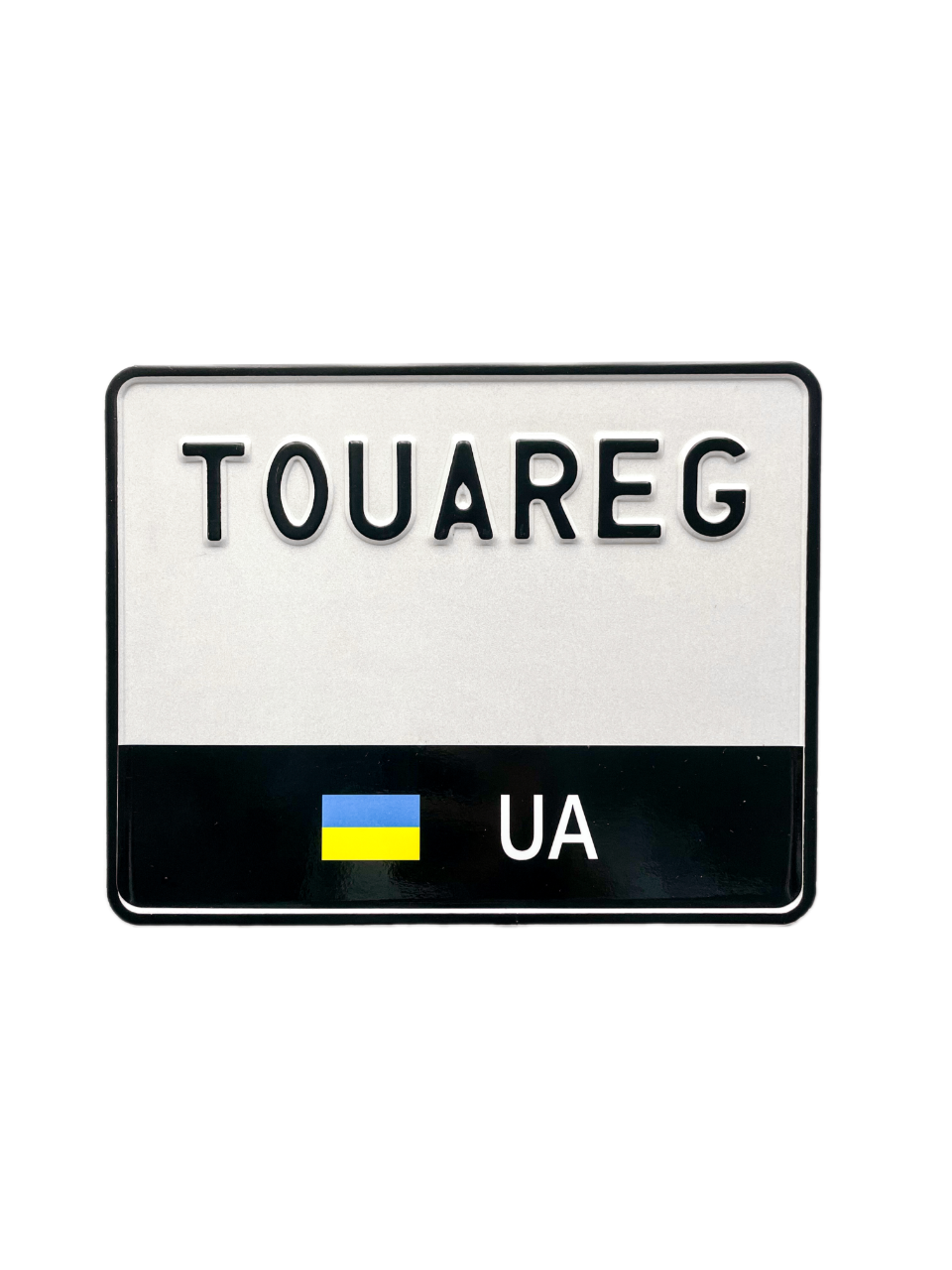 Сувенірний номерний знак на мотоцикл з написом "TOUAREG" і чорною наліпкою
