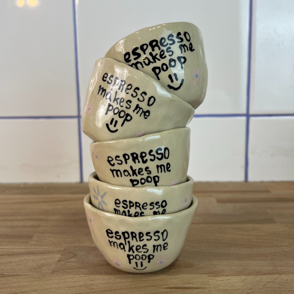 Espresso cup with funny text 'Espresso makes me poop'