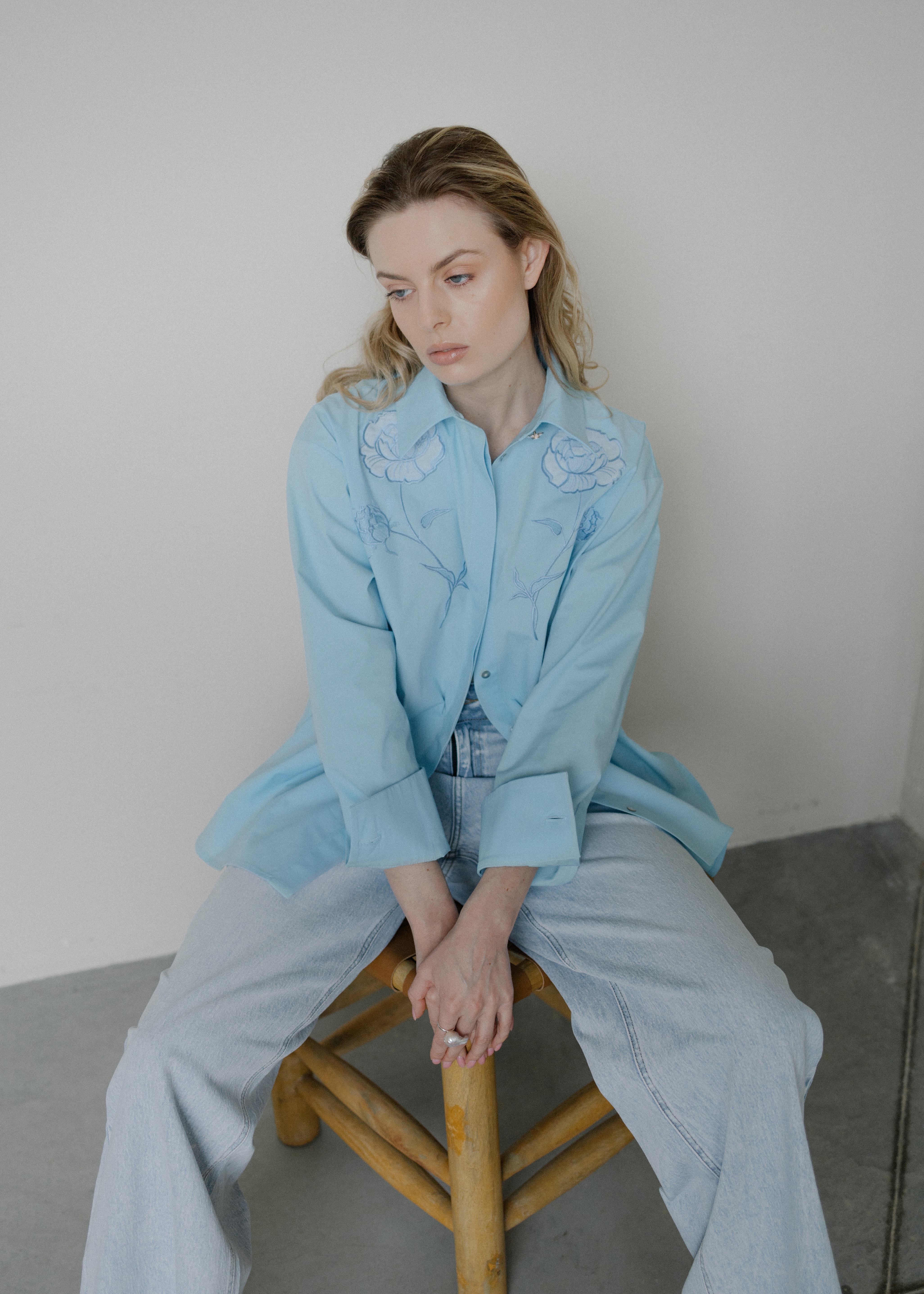 Blue shirt with embroidery .
