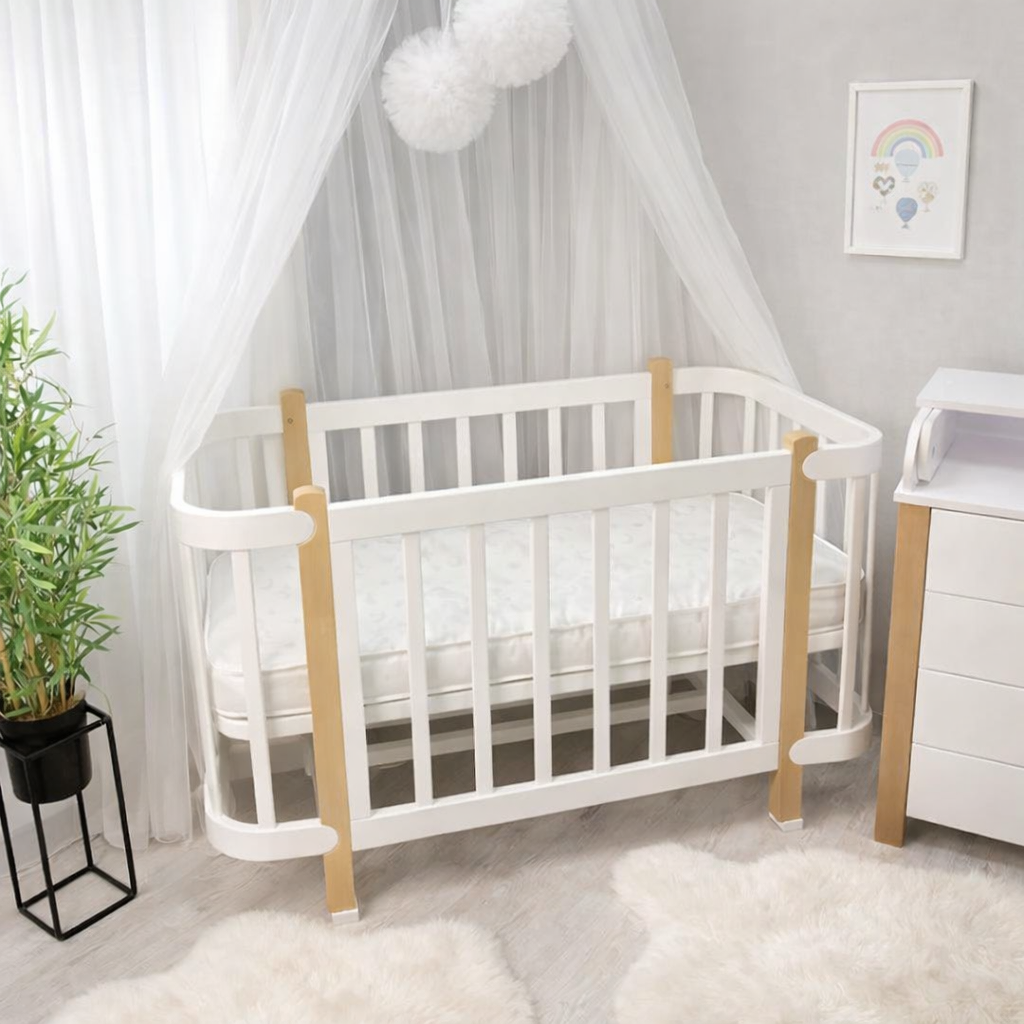 Ліжечко Престиж пускний бортик  з матрасом, маятником та колесами біле-натуральний