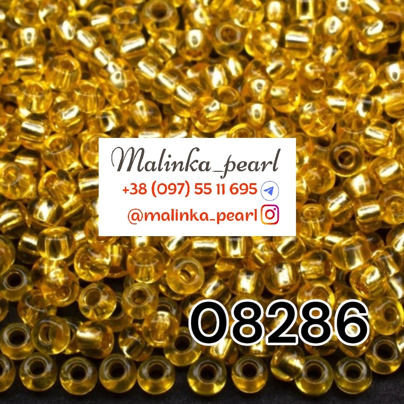 Бісер жовтий брудний, кристальний з блискучим срібним отвором