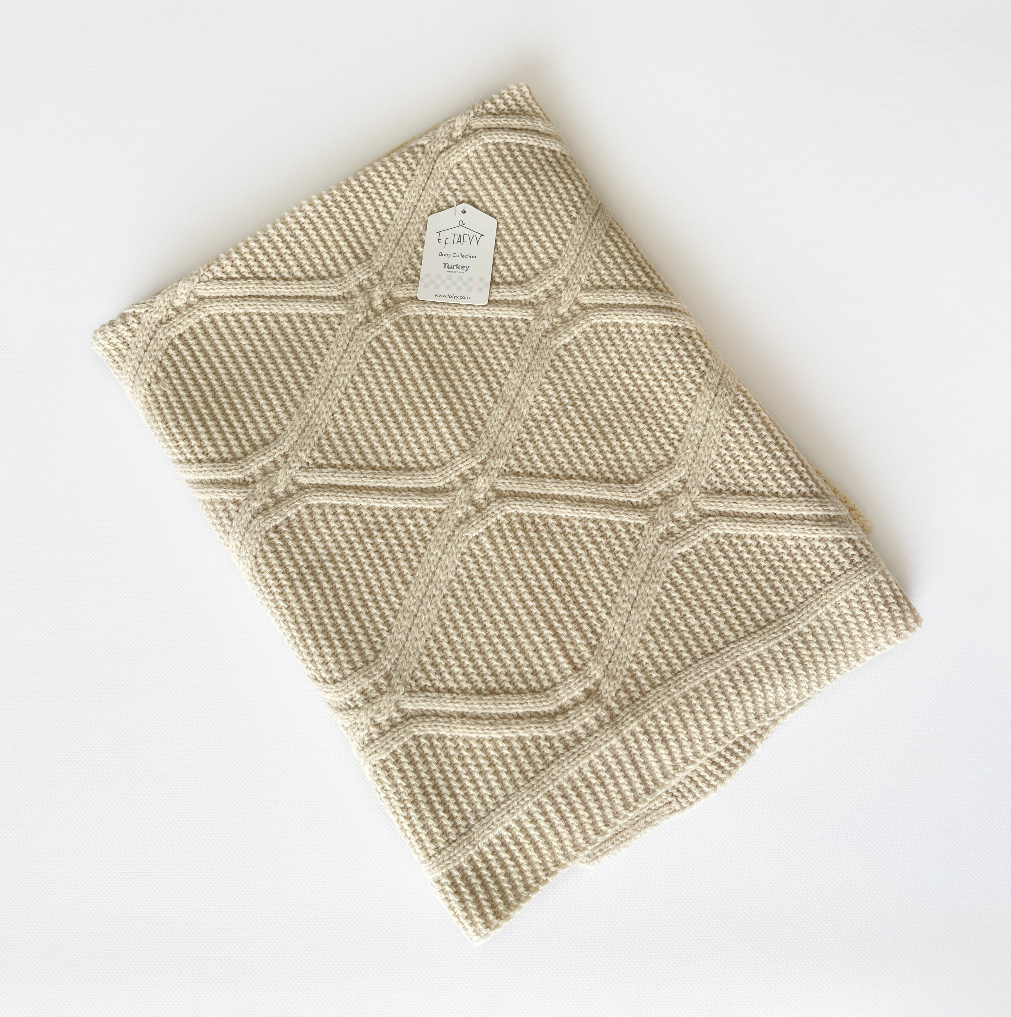 Бежева плетена ковдра