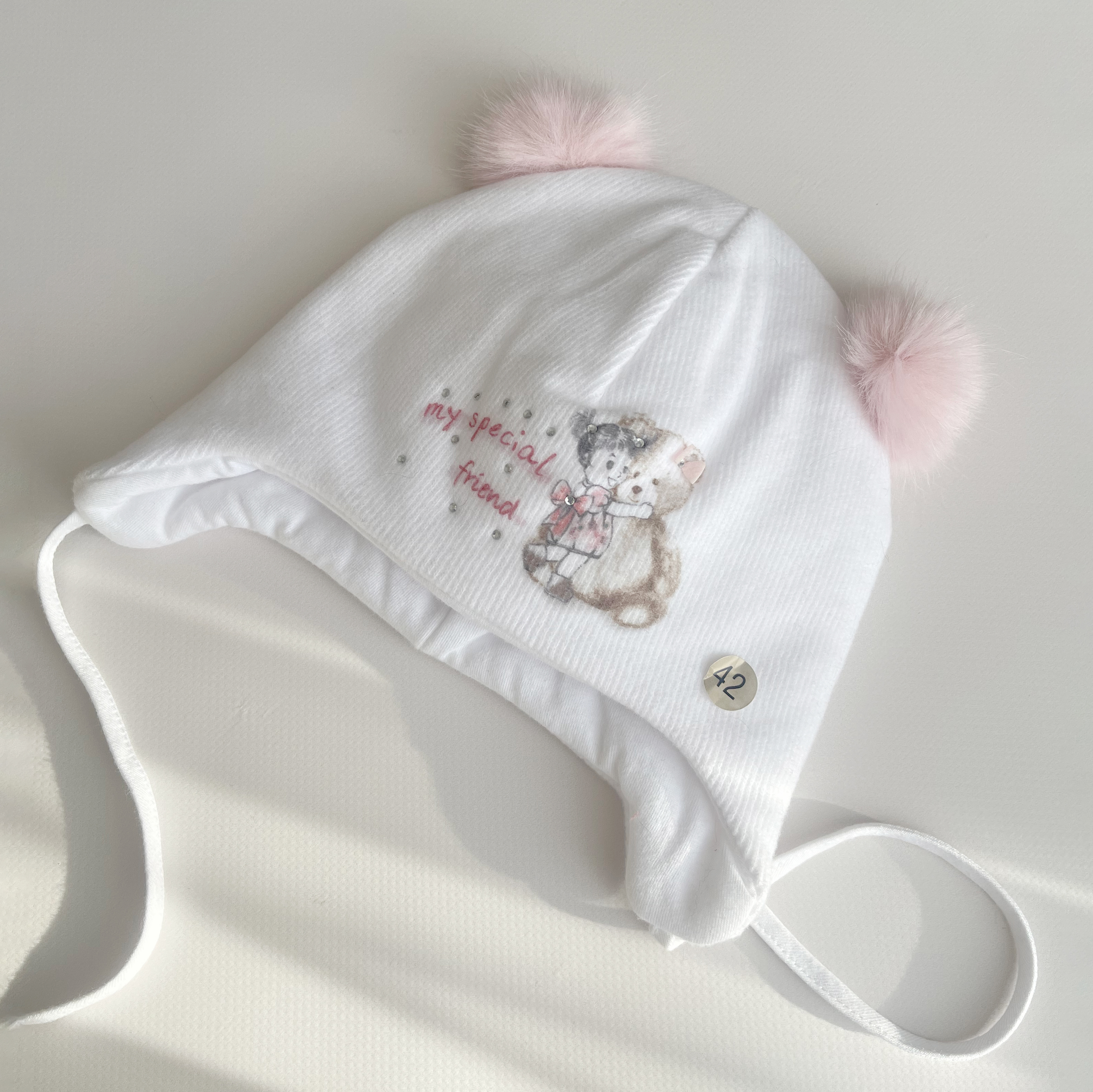 Шапка з мініпомпонами