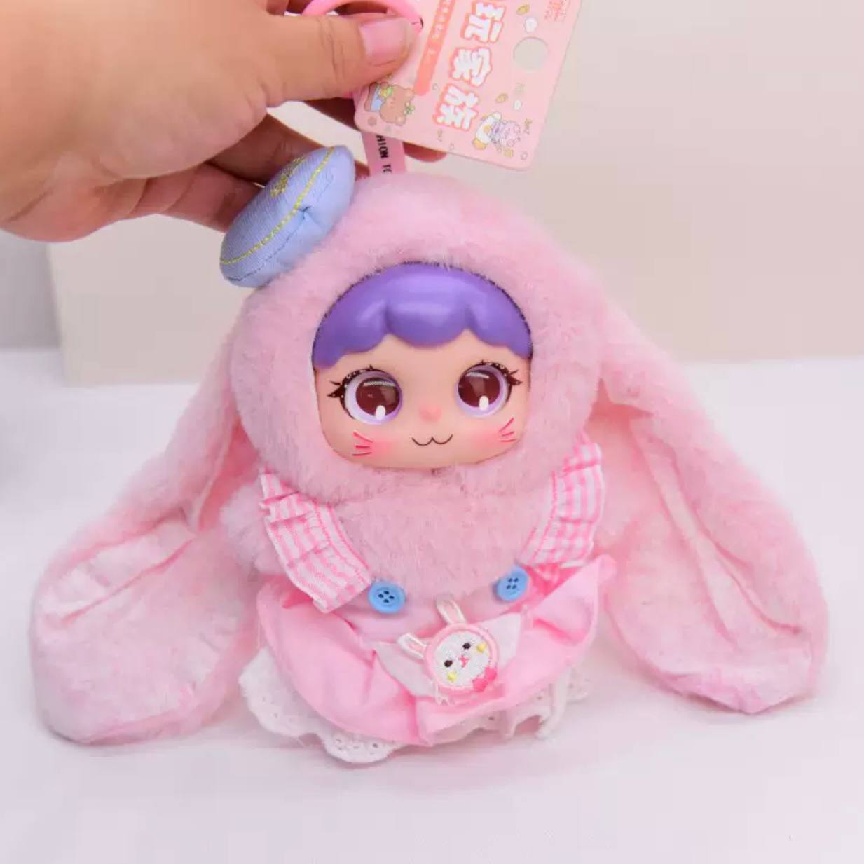 Іграшка брелок лялечка рожева з вушками