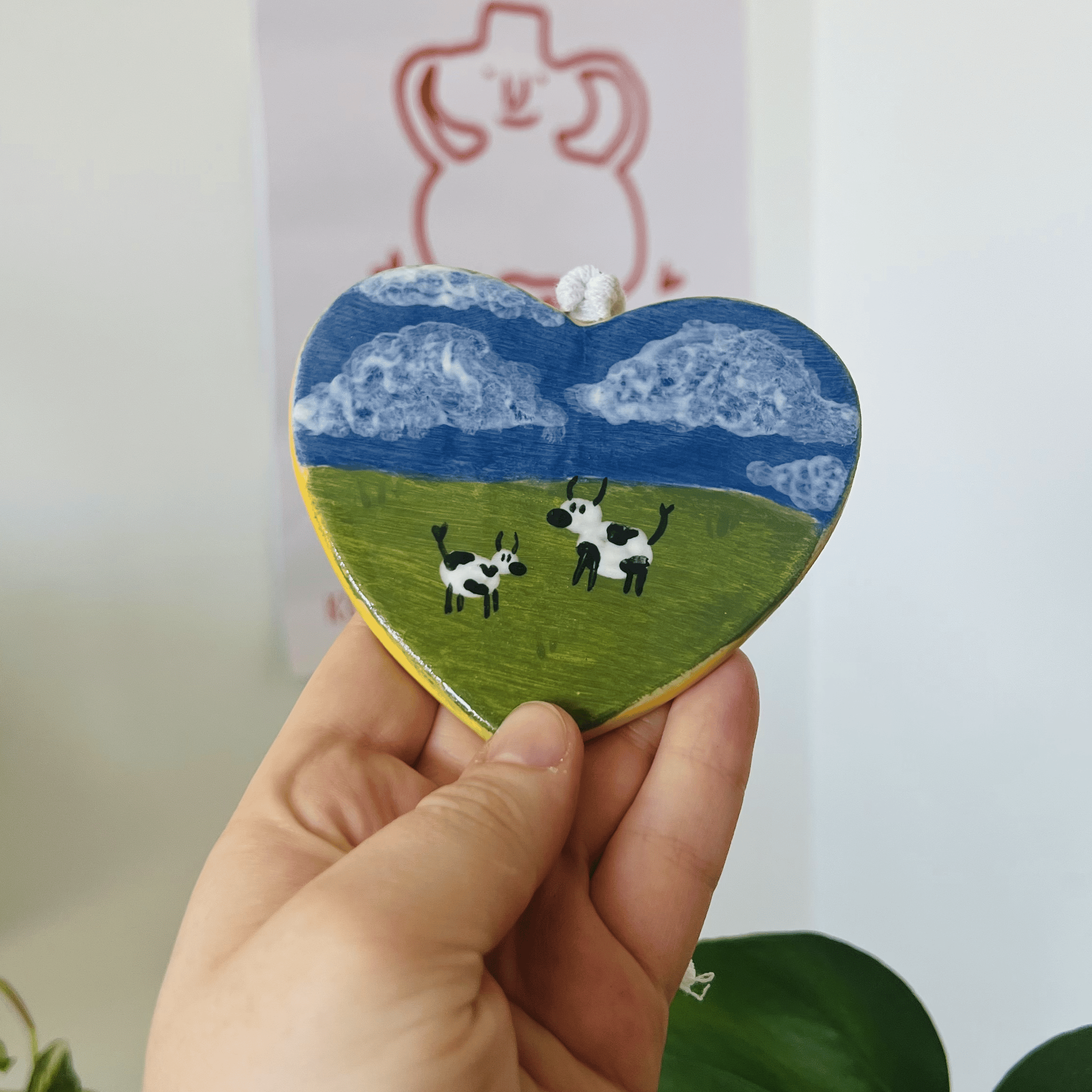Handmade Heart-Shaped Ceramic Wall Decor with Cows in Meadow