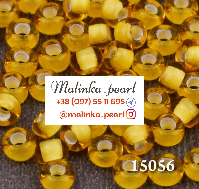 Бісер бежевий, прозорий з білим отвором